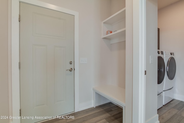 mudroom featuring hardwood / wood-style floors and washing machine and dryer