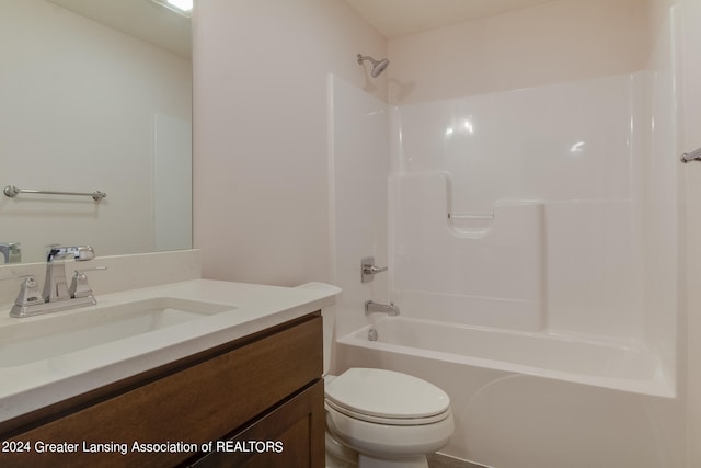 full bathroom with vanity, bathtub / shower combination, and toilet