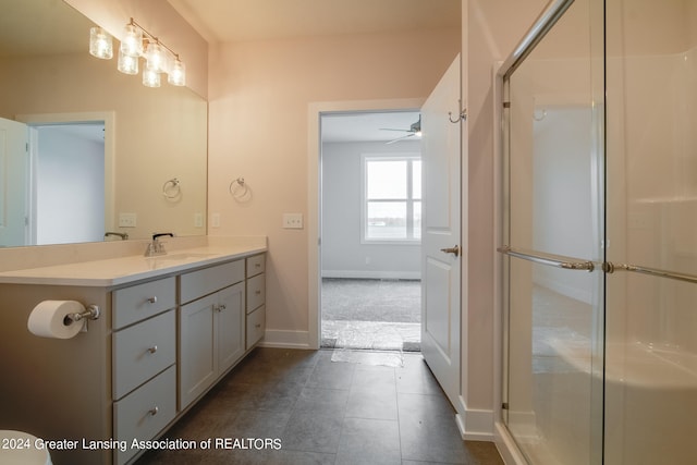 bathroom featuring tile floors, an enclosed shower, ceiling fan, and vanity