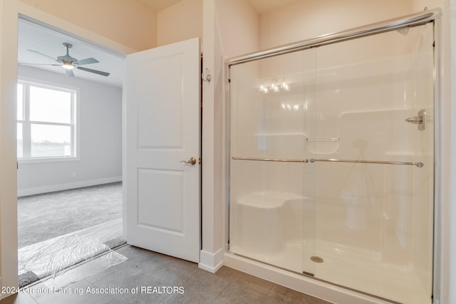 bathroom featuring an enclosed shower, tile flooring, and ceiling fan