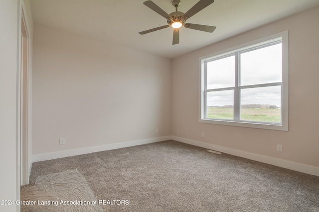 carpeted empty room with ceiling fan