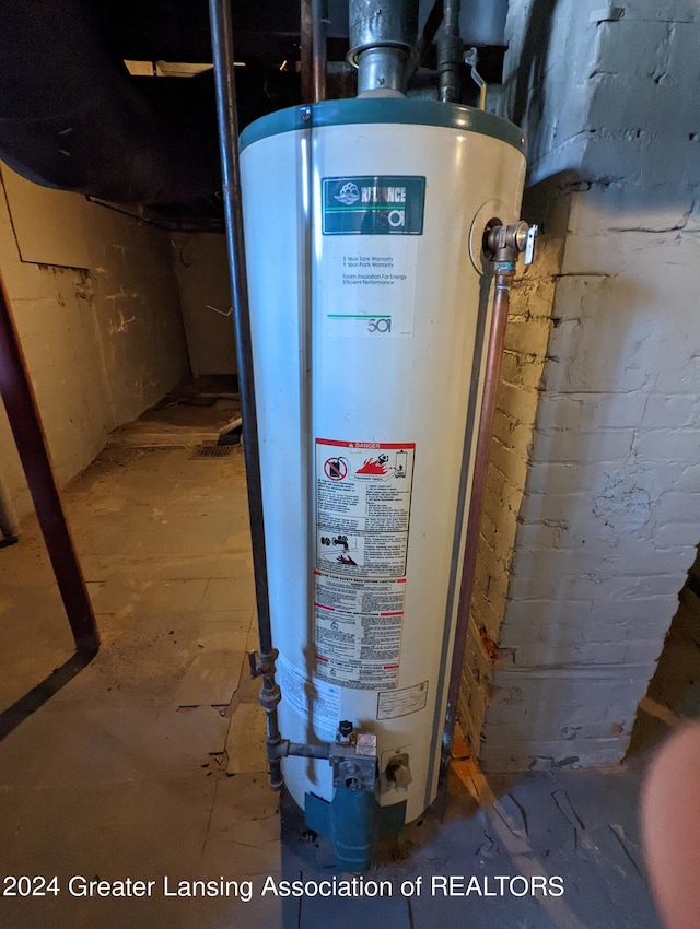 utility room featuring gas water heater