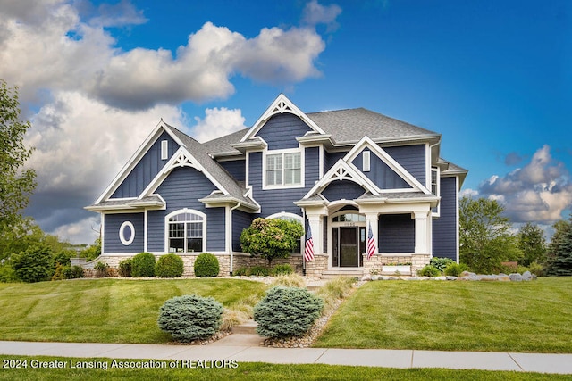 craftsman-style house with a front lawn