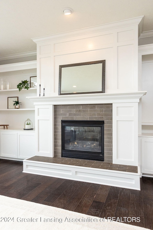 details with hardwood / wood-style floors and ornamental molding