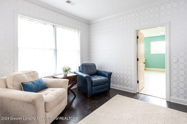 living area featuring dark hardwood / wood-style flooring and ornamental molding