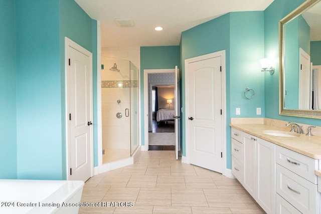 bathroom featuring vanity, tile patterned floors, and an enclosed shower