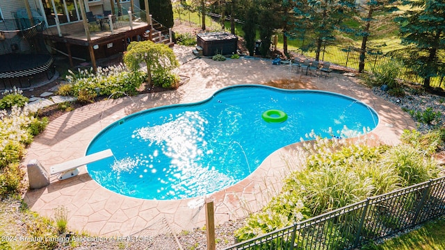 view of swimming pool featuring a fenced in pool, a patio area, and fence