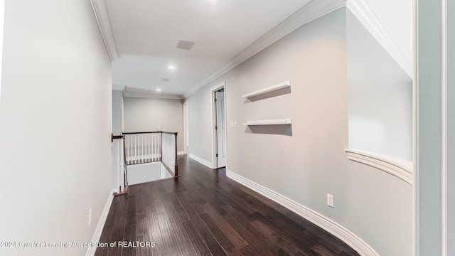 corridor featuring dark wood-style floors, recessed lighting, ornamental molding, an upstairs landing, and baseboards