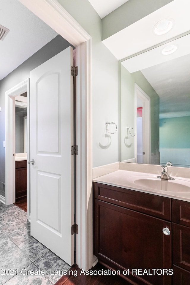 bathroom featuring visible vents and vanity