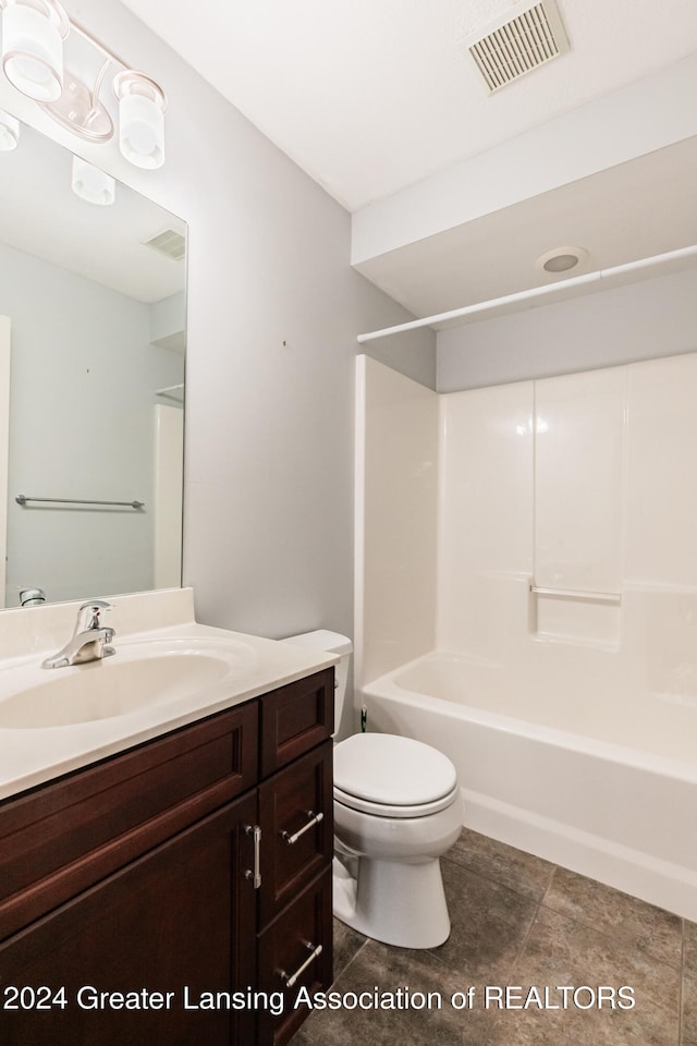 bathroom featuring visible vents, vanity, toilet, and shower / bathtub combination