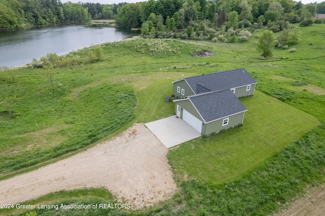 birds eye view of property with a rural view and a water view