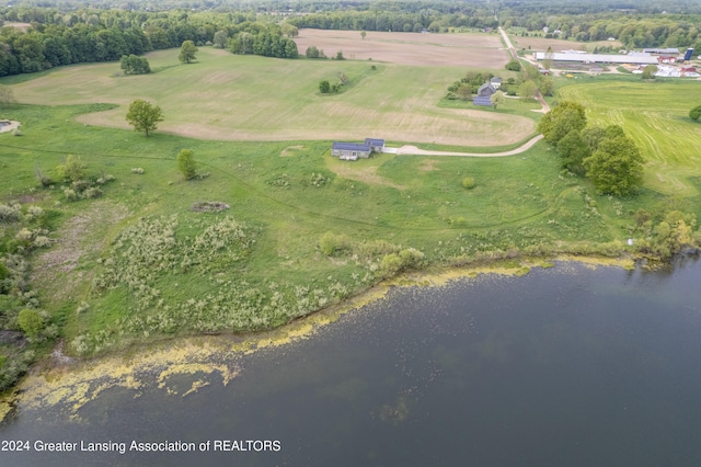 drone / aerial view with a water view and a rural view