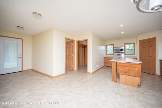 kitchen with a center island and stainless steel appliances