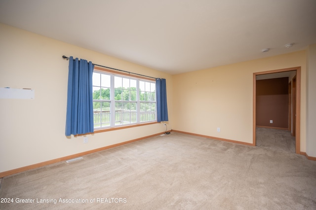 empty room featuring light colored carpet