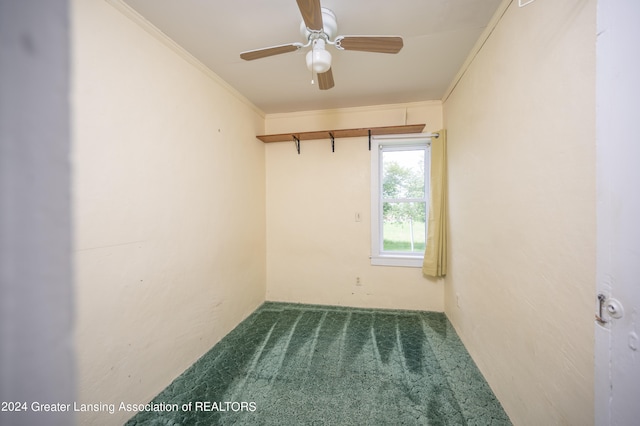 carpeted empty room featuring crown molding and ceiling fan