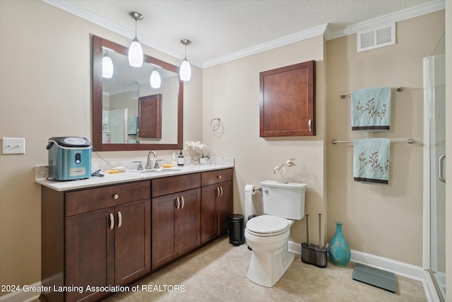 bathroom with a textured ceiling, vanity, an enclosed shower, and crown molding