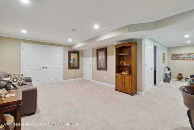 living room featuring crown molding and light carpet