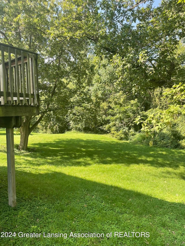 view of yard featuring a wooden deck