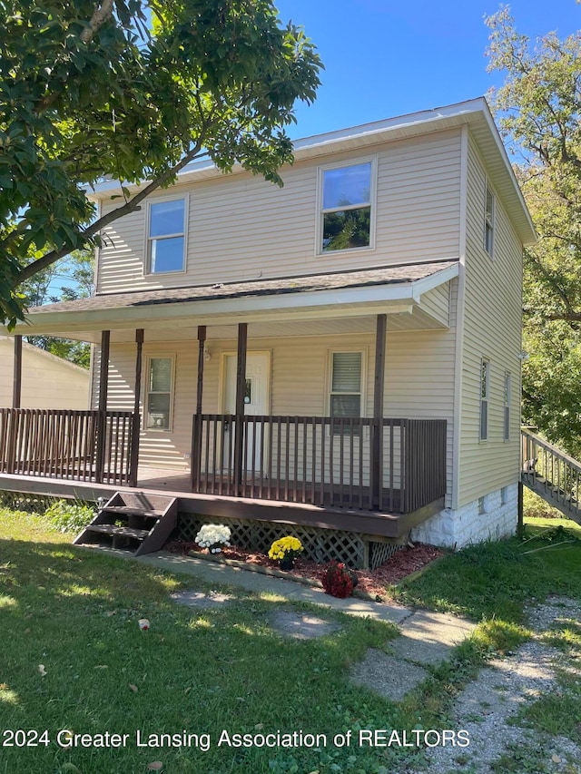 view of front of house featuring a front lawn and a porch