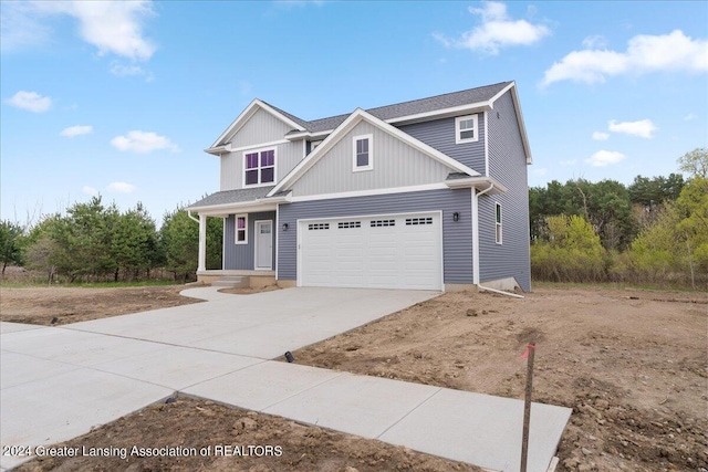 view of front of home featuring a garage and driveway