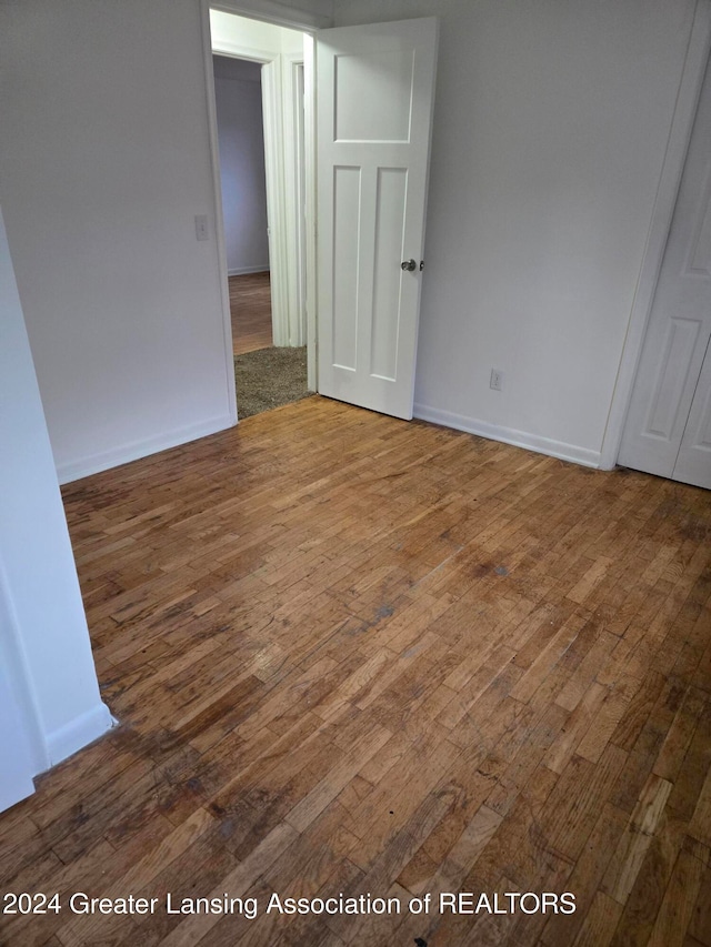 spare room featuring hardwood / wood-style floors