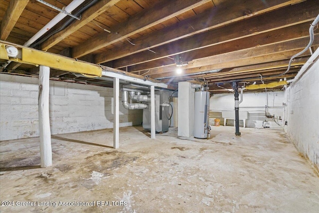 basement featuring heating unit and water heater