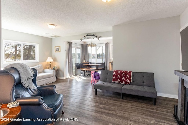 411 N Scott Dr, Farwell, MI 48622 - living room featuring a textured ceiling and wood finished floors