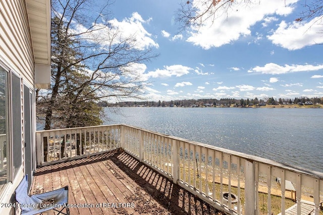 411 N Scott Dr, Farwell, MI 48622 - wooden deck featuring a water view