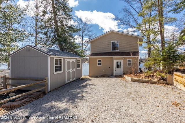 411 N Scott Dr, Farwell, MI 48622 - view of front facade with a storage unit