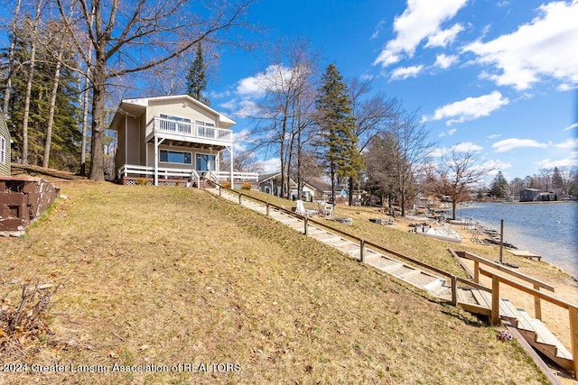 411 N Scott Dr, Farwell, MI 48622 - view of grassy yard with a balcony and a water view
