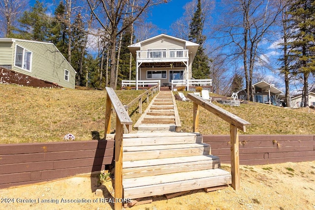 411 N Scott Dr, Farwell, MI 48622 - view of front of property with a balcony and stairs