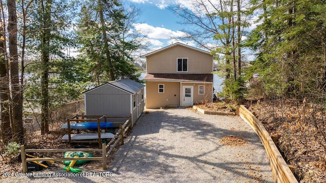 411 N Scott Dr, Farwell, MI 48622 - rear view of property featuring an outdoor structure
