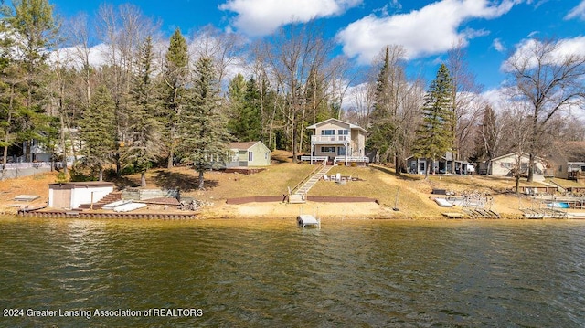 411 N Scott Dr, Farwell, MI 48622 - rear view of house featuring a water view and stairs