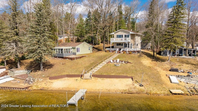 411 N Scott Dr, Farwell, MI 48622 - rear view of house featuring a balcony and stairway