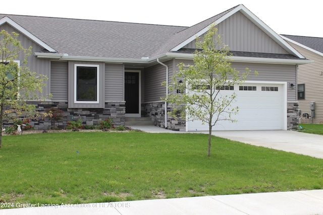 302 Vansickle Dr Unit 35, Charlotte, MI 48813 - craftsman house featuring board and batten siding, an attached garage, concrete driveway, stone siding, and a shingled roof