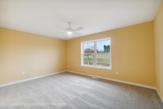 302 Vansickle Dr Unit 35, Charlotte, MI 48813 - carpeted empty room with baseboards and a ceiling fan