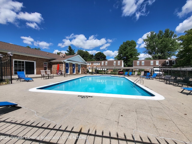 6347 Beechfield Dr, Lansing, MI 48911 - community pool with a patio