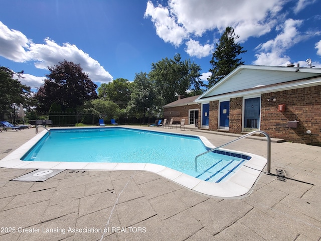 6347 Beechfield Dr, Lansing, MI 48911 - community pool with a patio area