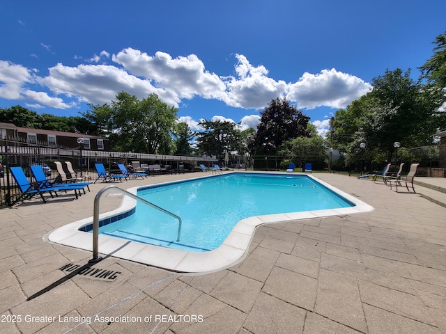 6347 Beechfield Dr, Lansing, MI 48911 - community pool with a patio area