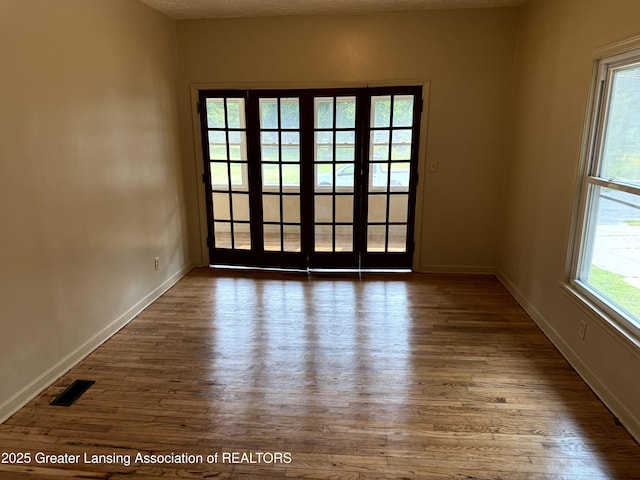 1555 Roosevelt Ave, Lansing, MI 48915 - spare room featuring wood-type flooring