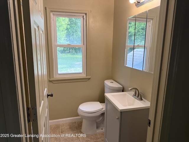 1555 Roosevelt Ave, Lansing, MI 48915 - bathroom featuring vanity, plenty of natural light, and tile patterned flooring