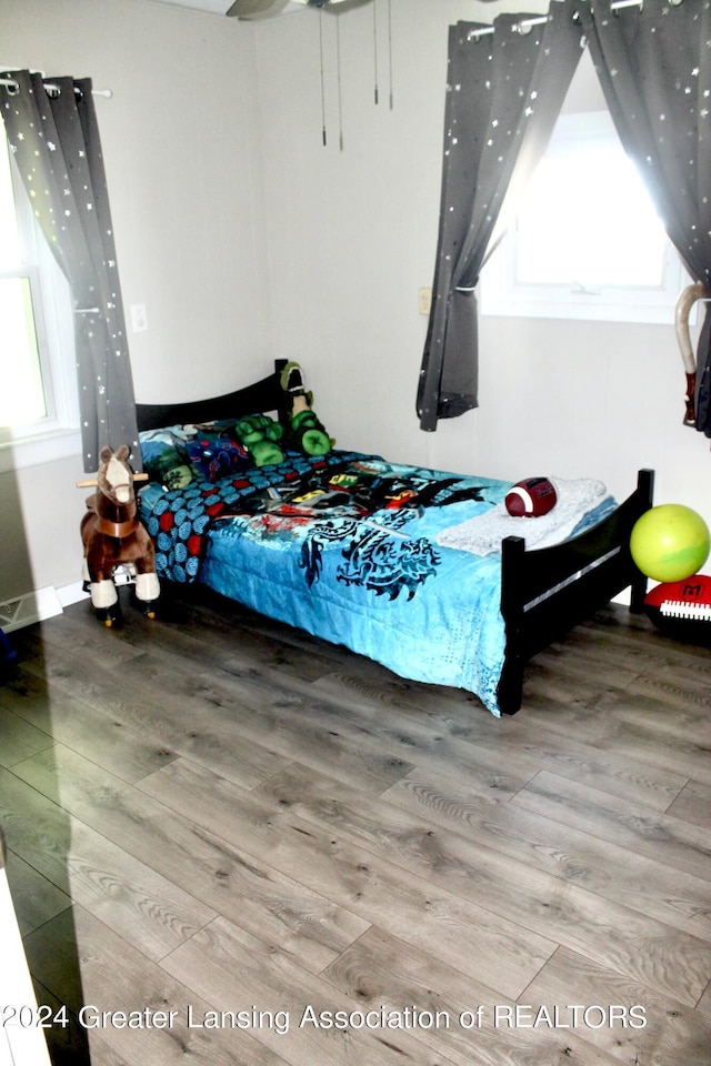 bedroom with wood-type flooring