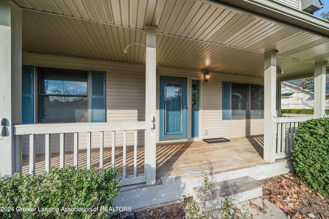 doorway to property featuring covered porch