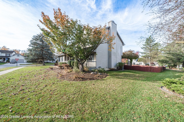 view of property exterior featuring a lawn