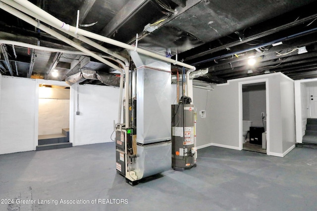 basement featuring gas water heater and heating unit