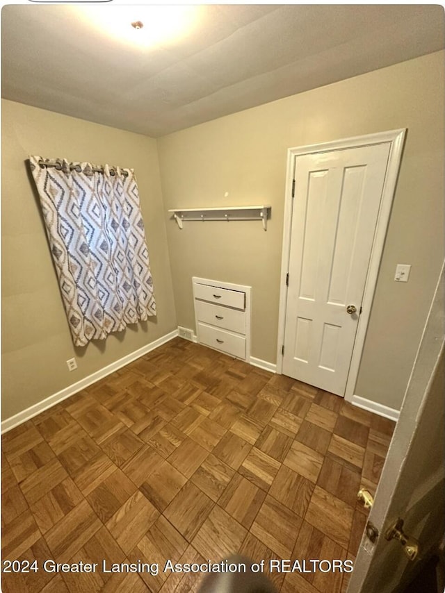 spare room featuring visible vents and baseboards