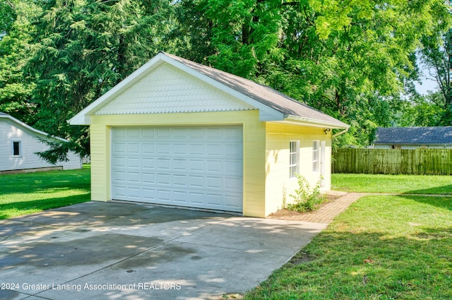 garage with a yard