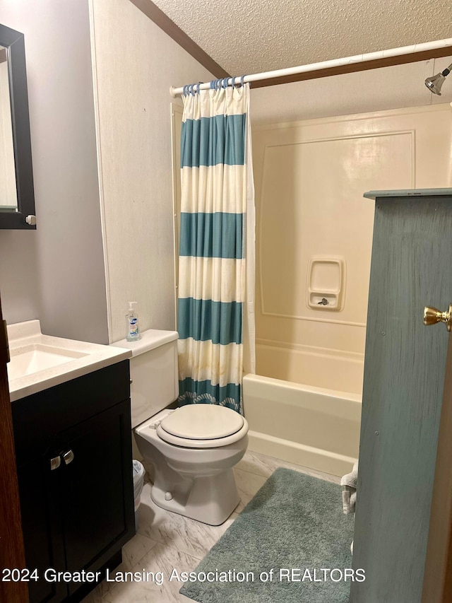 full bathroom with shower / tub combo with curtain, vanity, tile patterned floors, toilet, and a textured ceiling