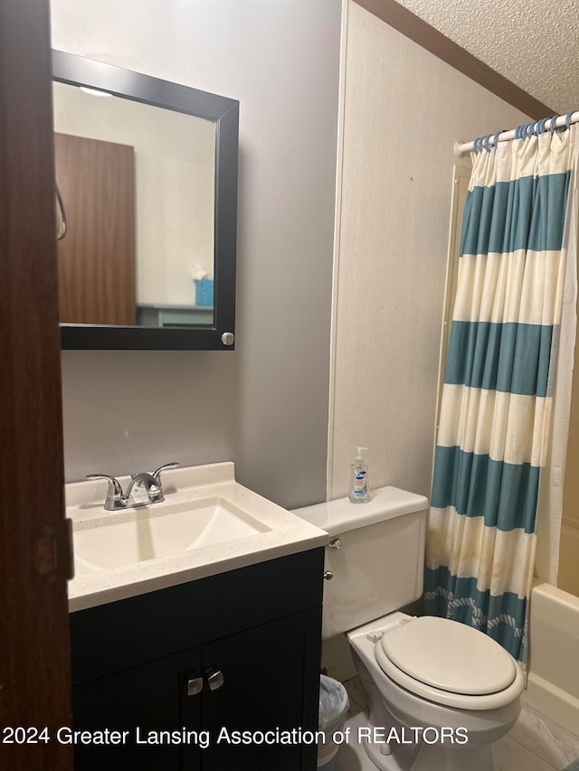 full bathroom with vanity, shower / tub combo with curtain, toilet, and a textured ceiling