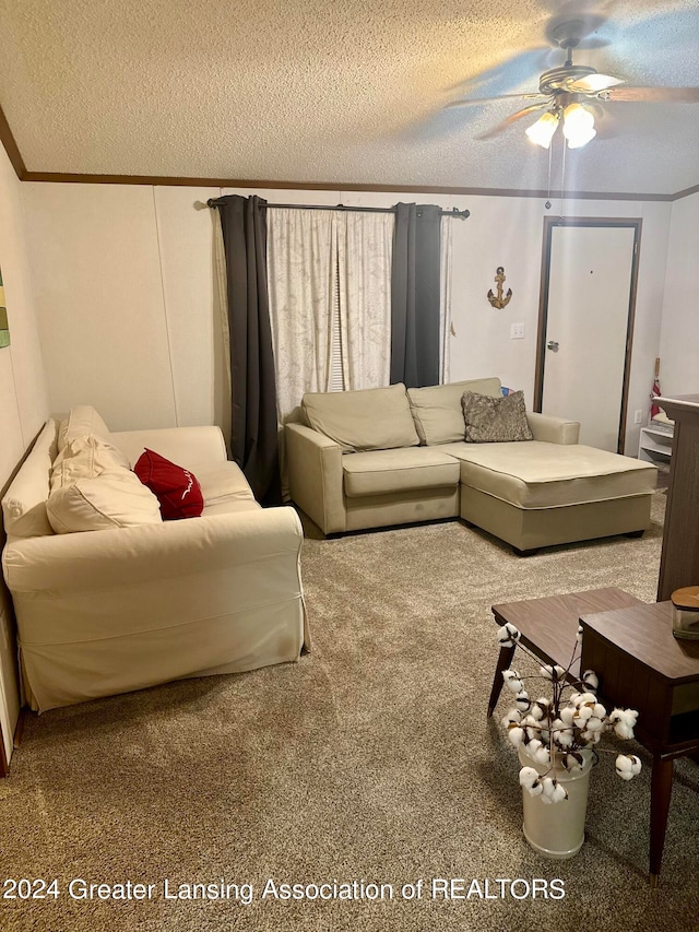 carpeted living room featuring a textured ceiling and ceiling fan